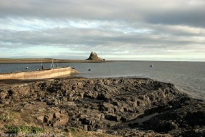 Harbour pier and castle across the bay.